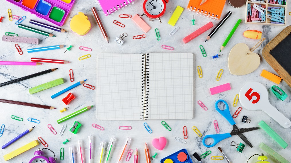 Colorful school supplies on a white background