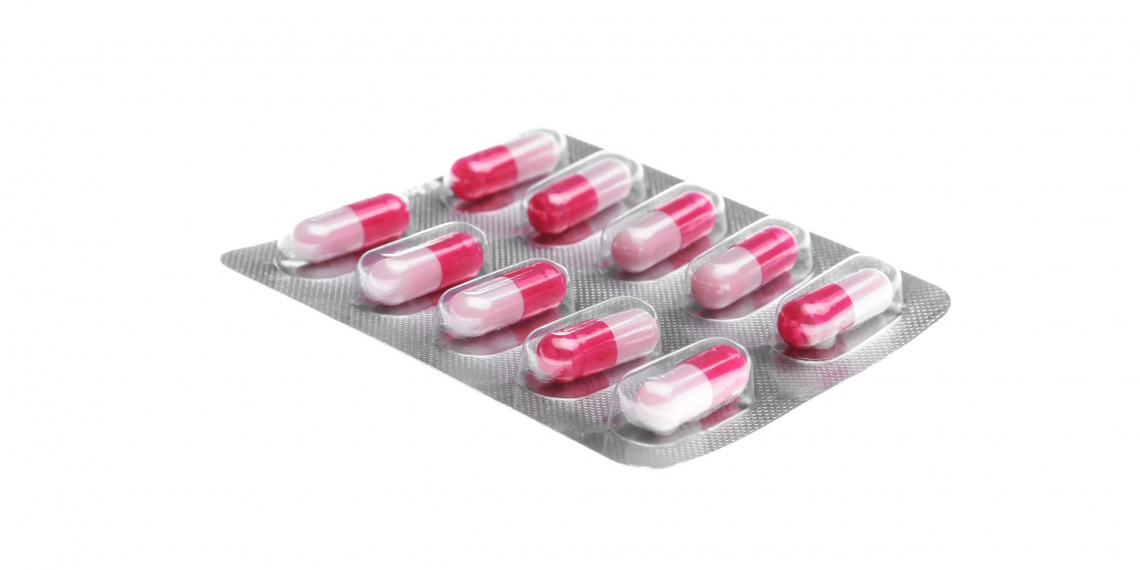 Pills in blister pack on white background