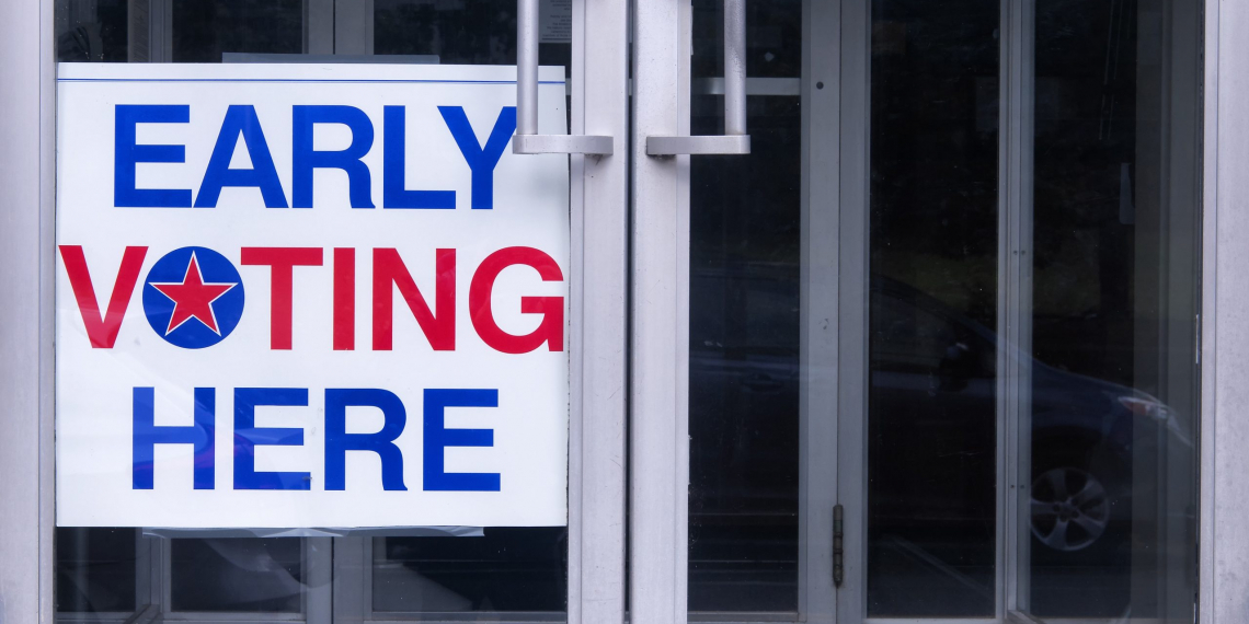 An early voting sign on a door welcoming people to vote for an democratic election in the united states of america.