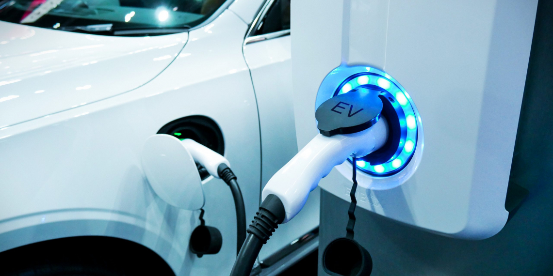 Power supply connect to electric vehicle for charge to the battery. Charging technology industry transport which are the futuristic of the Automobile.EV fuel Plug in hybrid car.